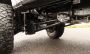 Load image into Gallery viewer, 4" COIL SPRING SUSPENSION SYSTEM WITH FALCON MAX3.3 SHOCKS AND RADIUS ARMS